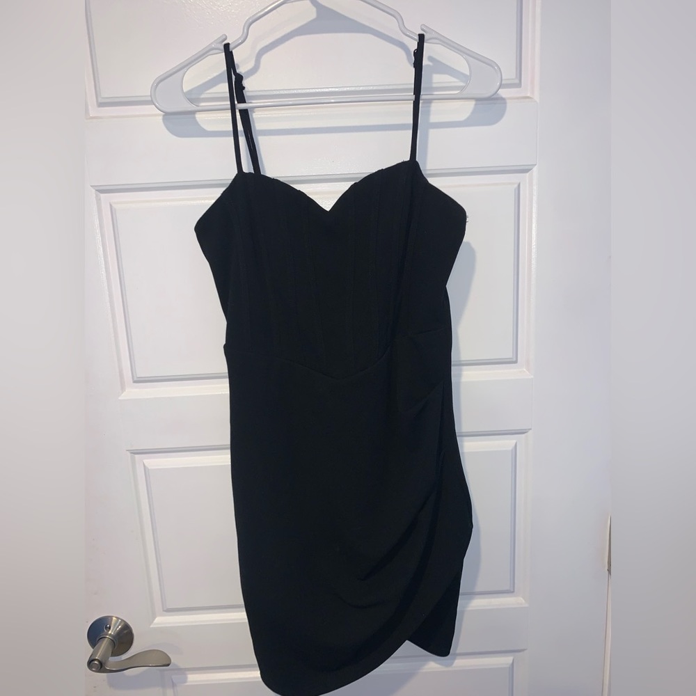 Lulu’s black ruffle mini v-line dress.